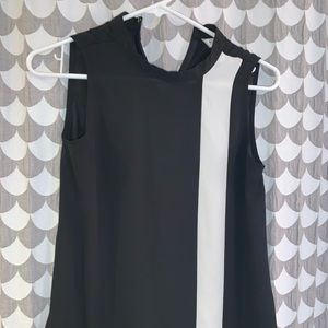 Sleeveless, business casual top.